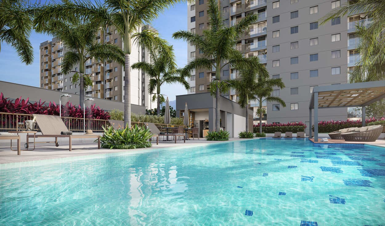 Piscina adulto e infantil do Metropolitan Dream com deck molhado e palmeiras – lazer Barra Olímpica